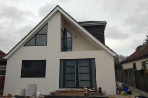 Shaped windows and composite front door on uxbridge home