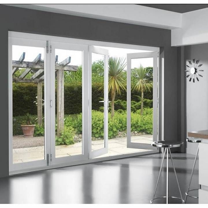 Modern white aluminium bifold doors opening to garden patio